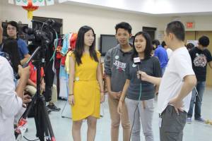 Students being interviewed on how they love the Chinese culture